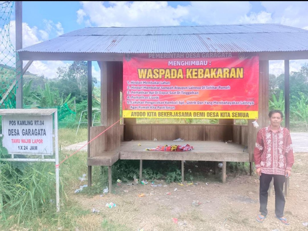 Pemerintah Desa Garagata memasang Spanduk Himbauan Waspada Kebakaran